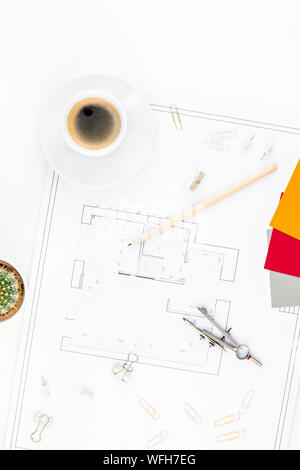 Creative flat lay overhead top view blueprint flat project plan hot coffee cup and office supplies on decorator table workspace swatches tools and equ Stock Photo