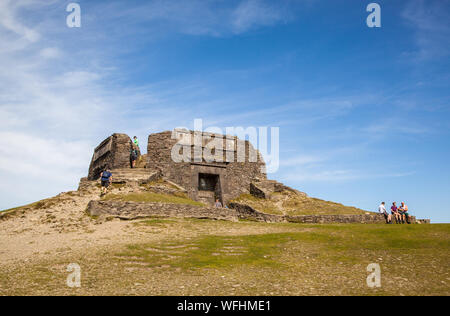 Men women children and families in the Clwydian Hills North Wales near the Jubliee Tower on the summit of Moel Famau  mountain Stock Photo