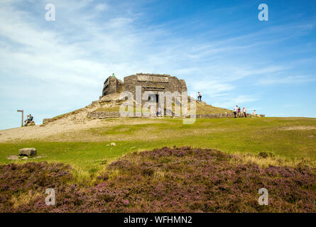 Men women children and families in the Clwydian Hills North Wales near the Jubliee Tower on the summit of Moel Famau  mountain Stock Photo