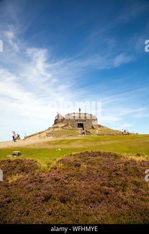 Men women children and families in the Clwydian Hills North Wales near the Jubliee Tower on the summit of Moel Famau  mountain Stock Photo