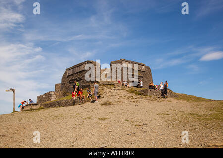 Men women children and families in the Clwydian Hills North Wales near the Jubliee Tower on the summit of Moel Famau  mountain Stock Photo