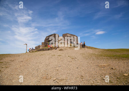 Men women children and families in the Clwydian Hills North Wales near the Jubliee Tower on the summit of Moel Famau  mountain Stock Photo