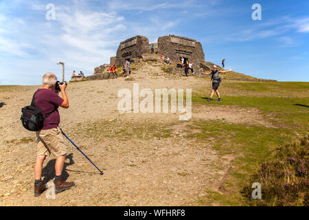 Men women children and families in the Clwydian Hills North Wales near the Jubliee Tower on the summit of Moel Famau  mountain Stock Photo