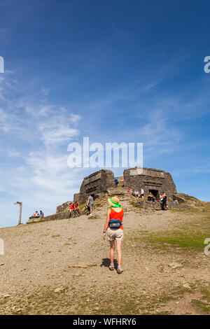 Men women children and families in the Clwydian Hills North Wales near the Jubliee Tower on the summit of Moel Famau  mountain Stock Photo