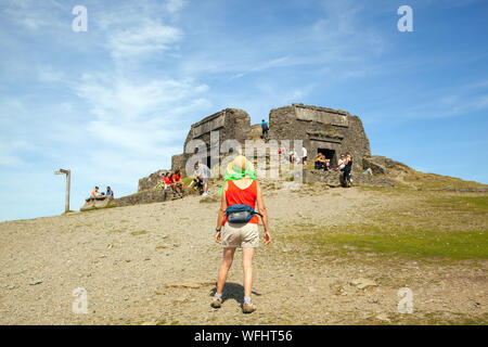 Men women children and families in the Clwydian Hills North Wales near the Jubliee Tower on the summit of Moel Famau  mountain Stock Photo