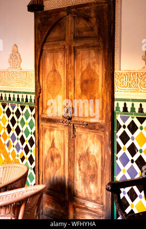 very old rusty padlock on door with arabic carved ornaments Stock Photo