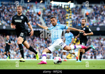 Manchester City's Bernardo Silva (centre) scores his side's fourth goal of the game during the Premier League match at the Etihad Stadium, Manchester.