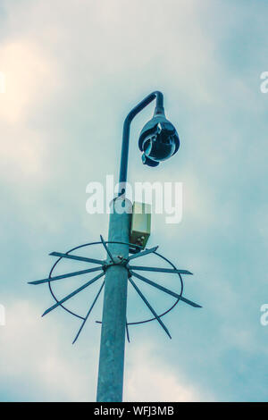 CCTV camera with spiked protection ring Stock Photo