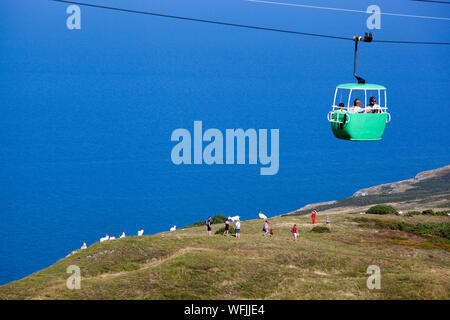 The colourful Llandudno Cable Car as it passes over the Great Orme Llandudno North Wales Stock Photo