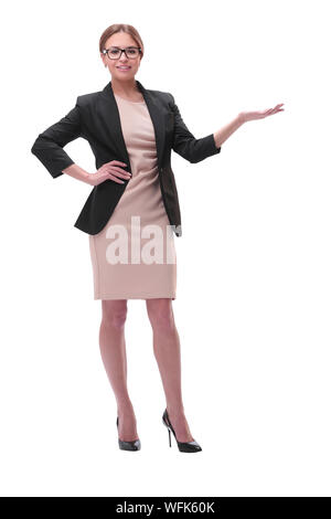 Businesswoman holding blank copy space on her open palm standing in full length Stock Photo