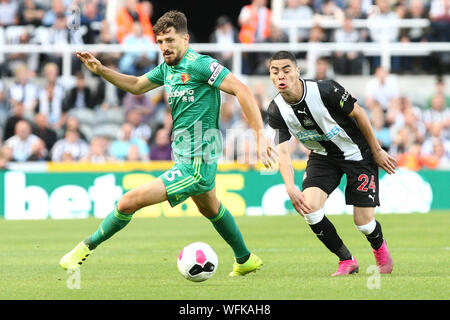 NEWCASTLE UPON TYNE, ENGLAND. AUG 31ST Newcastle United's Miguel Almiron competes for the ball with Watford's Craig Cathcart during the Premier League match between Newcastle United and Watford at St. James's Park, Newcastle on Saturday 31st August 2019. (Credit: Steven Hadlow | MI News)Editorial use only, license required for commercial use. No use in betting, games or a single club/or magazine editorial purposes Credit: MI News & Sport /Alamy Live News