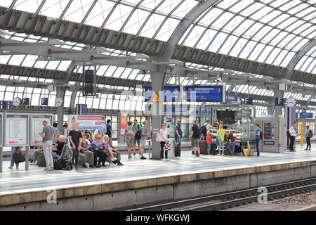 People wait for train at Spandau train station Berlin Germany Stock Photo