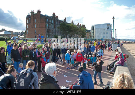 Portobello, Edinburgh, Scotland, UK. 31st August 2019. The Edinburgh Big Beach Busk returned for a tenth time this year, with Portobello beach promenade welcoming hundreds of musicians. The huge busking event was originally arranged as a way of giving a space to Edinburgh buskers who were perhaps squeezed by the Festival. The Violin Boys. Stock Photo