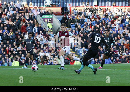 Burnley, UK. 31st Aug, 2019.  Sadio Mane of Liverpool shoots and scores his teams 2nd goal. Premier League match, Burnley v Liverpool at Turf Moor in Burnley, Lancashire on Saturday 31st August 2019. this image may only be used for Editorial purposes. Editorial use only, license required for commercial use. No use in betting, games or a single club/league/player publications. pic by Chris Stading/Andrew Orchard sports photography/Alamy Live news Credit: Andrew Orchard sports photography/Alamy Live News Credit: Andrew Orchard sports photography/Alamy Live News Stock Photo