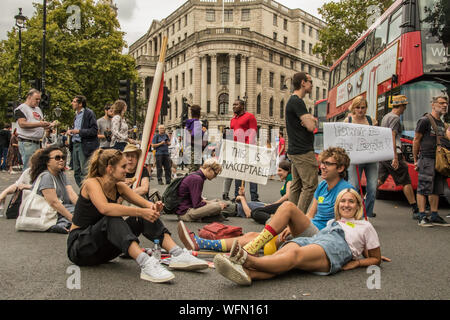 London,UK. 31 August 2019. 'This is unacceptable' reads the placard as protesters blocked the roads at Trafalgar Square. Thousands marched and blocked central London roads in  a protest to defend democracy and against the prorogation of Parliament. David Rowe/Alamy Live News. Stock Photo