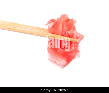Pile of marinated ginger slices isolated on white background. Pickled ginger isolated. Chopsticks. Stock Photo