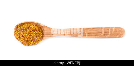 Spoon with Dijon delicious mustard sauce isolated on white background. Mustard on wooden spoon isolated Stock Photo