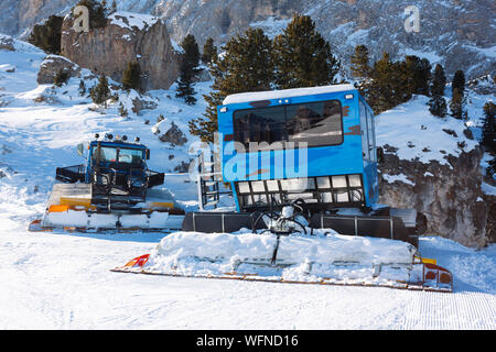 Ratrac machine for skiing slope preparations in the mountains. Snow groomers for ski slopes preaparation in winter resort. Stock Photo