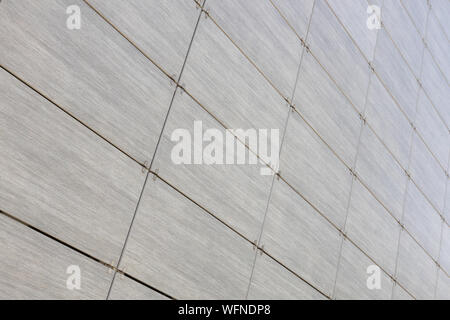 Textured pattern on gray rectangular tiles with dark space in between, diagonal view. Stock Photo