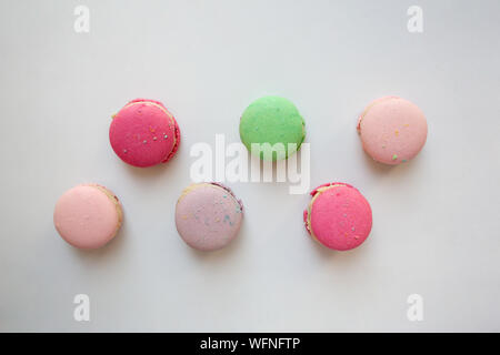 Pastel colored macaroons isolated on white background from a high angle view Stock Photo