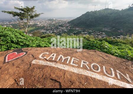 Cameroon, Centre Region, Mfoundi Department, Yaounde, Mount Febe, elevated view of Yaounde north western neighbourhoods with a Love Cameroon tag in the foreground Stock Photo