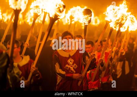 United Kingdom, Scotland, Shetland Islands, Mainland, Lerwick, Up Helly Aa festival, squad of Guizers parading to the site where the viking longship will be set on fire Stock Photo