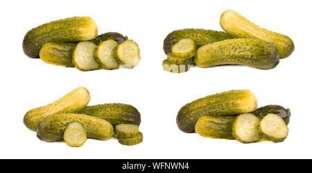 Set of pickled gherkins or marinated cucumbers Isolated on white background. Fermented food with spices. Closeup Stock Photo