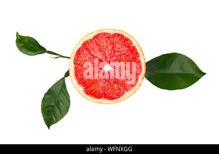 Grapefruit piece isolated on white background. Fresh fruit. With clipping path. Fresh grapefruit with green leaves isolated. Stock Photo