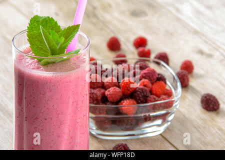 Close-up Of Raspberry Smoothie In Glass On Table
