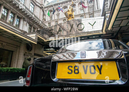 A Rolls Royce with a private registration number plate S8VOY outside the Savoy Hotel in London Stock Photo