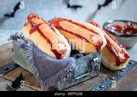 Creepy Halloween hot dogs look like a bloody fingers Stock Photo