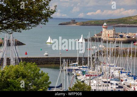 Ireland, Fingal County, Northern Dublin Suburbs, Howth, Fishing and Yachting Harbor and Howth Lighthouse Stock Photo