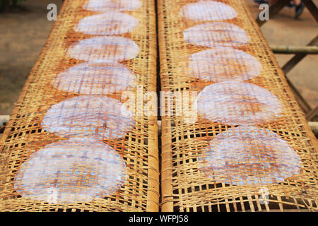 drying hand made rice paper outside Stock Photo