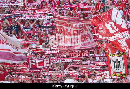 fans, supporters, spectators, club flags,  celebration, fan, wave, colors, sea of flags, soccerfan, clothes, drawings, masquerade, football, jacket, cowl, waistcoat, fanfare, scarves, mask,   FC BAYERN MUNICH - FSV MAINZ 05  6-1 - DFL REGULATIONS PROHIBIT ANY USE OF PHOTOGRAPHS as IMAGE SEQUENCES and/or QUASI-VIDEO -  1.German Soccer League , Munich, August 31, 2019  Season 2019/2020, matchday 03, FCB, München © Peter Schatz / Alamy Live News Stock Photo