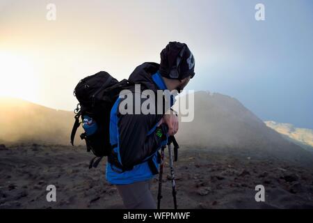 Italy, Sicily, Aeolian Islands, listed as World Heritage by UNESCO, Stromboli island, hiker climbing the volcano Stock Photo