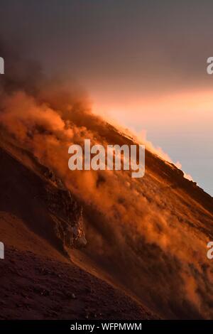 Italy, Sicily, Aeolian Islands, listed as World Heritage by UNESCO, Stromboli island, fumaroles of an eruption and fall of lava bombs on the slopes of the active volcano at sunset