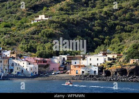 Italy, Sicily, Aeolian Islands, listed as World Heritage by UNESCO, Salina Island, fisherman in his boat returning to the port of Rinella Stock Photo