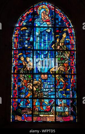 France, Manche, Cotentin, Sainte Mere Eglise, stained glass showing the Virgin Mary surrounded by parachutists in memory of the D day landings Stock Photo