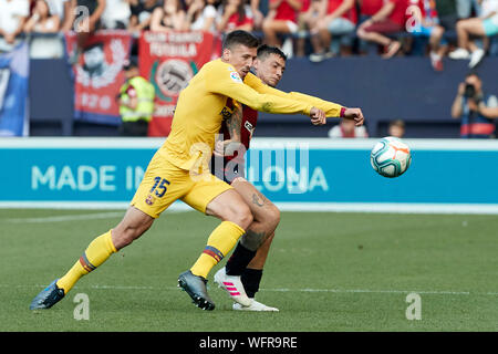 Clement Lenglet (defender; FC Barcelona) and Chimy Avila (forward; CA Osasuna) in action during the Spanish La Liga Santander, match between CA Osasuna and FC Barcelona at the Sadar stadium.(Final score: CA Osasuna 2 - 2 FC Barcelona) Stock Photo