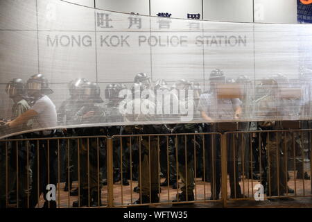 Hong Kong, China. 31st Aug, 2019. 31st August 2019. Hong Kong Anti Extradition Bill protests. After a day of many violent clashes with police angry residents surrounded Mong Kok Police Station to show their anger towards police actions that day Credit: David Coulson/Alamy Live News