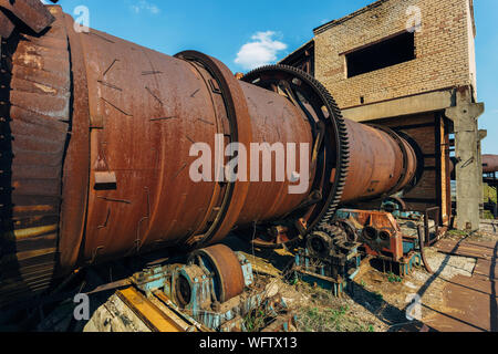 Old rusty rotating kiln in cement manufacturing plant Stock Photo - Alamy