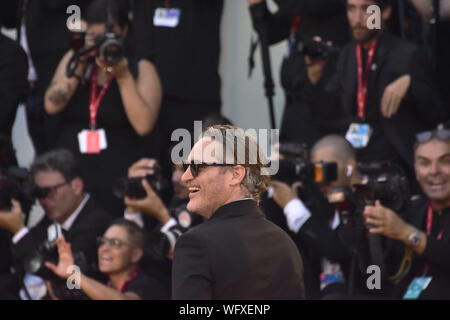 Venice, Italy. 31st Aug, 2019. Joaquin Phoenix walks the red carpet for the World Premiere of Joker during the 76th Venice Film Festival at Palazzo del Cinema on August 31, 2019 in Venice, Italy. Credit: Awakening/Alamy Live News Stock Photo