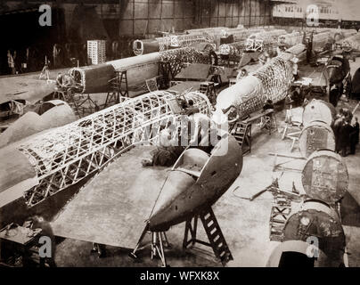 The production line of Vickers-Armstrong Wellington, twin-engined, long-range medium bomber. It was designed during the mid-1930s  by Vickers-Armstrongs' chief designer Rex Pierson; a key feature of the aircraft is its geodetic airframe fuselage structure that gave strength and lightness, principally designed by Barnes Wallis. With a flurry of order and production having been assured by the end of 1937, Vickers set about simplifying the manufacturing process of the aircraft and announced a target of building one Wellington per day. Stock Photo