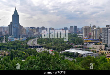 Urumqi modern city skyline and highway from Hongshan park - Xinjiang Uygur Autonomous province, China Stock Photo