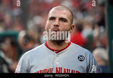 Cincinnati Reds' Joey Votto walks onto the field with his gear prior to a spring  training baseball game against the Chicago Cubs Saturday, March 27, 2021,  in Goodyear, Ariz. (AP Photo/Ross D.