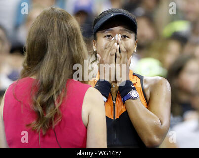 New York, USA. 31st Aug, 2019. Winner Naomi Osaka of Japan reacts in tears after defeating Coco Gauff in the 3rd round in Arthur Ashe Stadium at the 2019 US Open Tennis Championships at the USTA Billie Jean King National Tennis Center on Saturday, August 31, 2019 in New York City. Osaka defeated Gauff in straight sets to advance to the 4th round. Credit: UPI/Alamy Live News Stock Photo