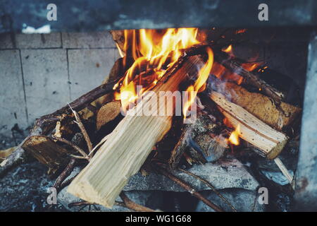 Close Up Of Wooden Log Burning At Fireplace Stock Photo 270916089