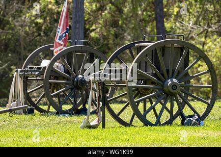 Civil War era cannons with a confederate flag in a battlefield during an American Civil War reenactment Stock Photo