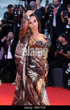 Venice, Italy. 31st Aug, 2019. Model Madalina Diana Ghenea poses on the red carpet for the premiere of the film 'Joker' during the 76th Venice International Film Festival in Venice, Italy, Aug. 31, 2019. Credit: Zhang Cheng/Xinhua/Alamy Live News Stock Photo