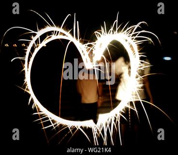 Close-up Of Heart Shape Light Painting At Night